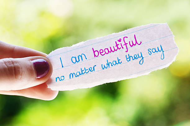 istock Woman's hand holds hand-drawn encouraging affirmation 155350954