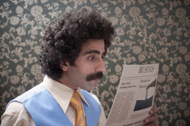 istock Businessman with big hair reading newspaper 155351018