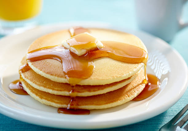 Pancakes with butter and syrup  pancake photos stock pictures, royalty-free photos & images