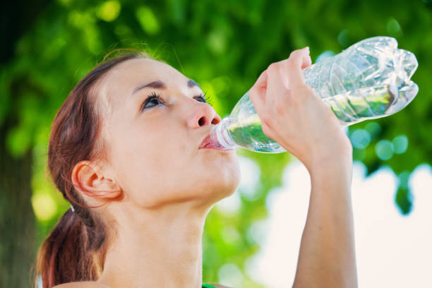 istock Woman drinking water after sport activities 155351286