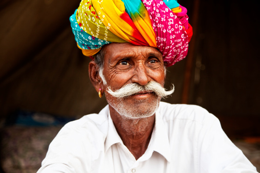 senior man with colorful turban, cattle fair in Pushkar, Rajasthan, India