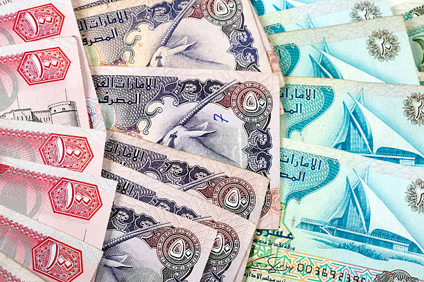 mundo moedas. dirrã dos emirados árabes unidos - moroccan currency fotos imagens e fotografias de stock