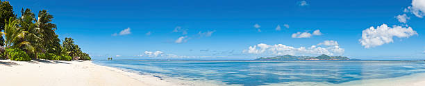istock Idyllic vacation beach white sands tropical island blue lagoon 155351893