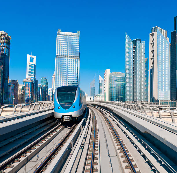 istock Dubai Metro Train  against modern city back ground 155351972