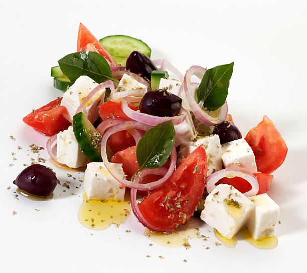 Greek salad Feta cheese with sliced tomatoes,cucumber,black olives,onion,oregano and olive oil Greek Salad stock pictures, royalty-free photos & images