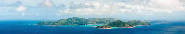 istock Tropical islands in tranquil blue ocean panorama 155352092