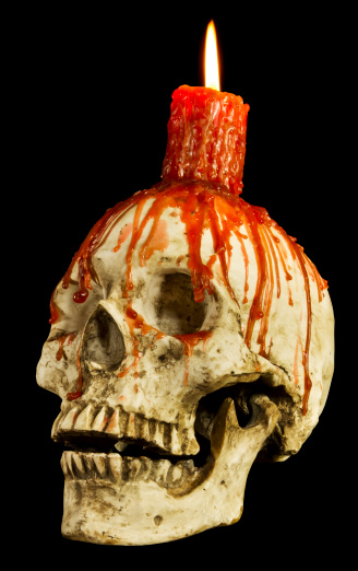 Red candle melted on top of a human skull resin replica. Includes hand made clipping path for easy selection and use. Shot on EOS 7D with studio lights.
