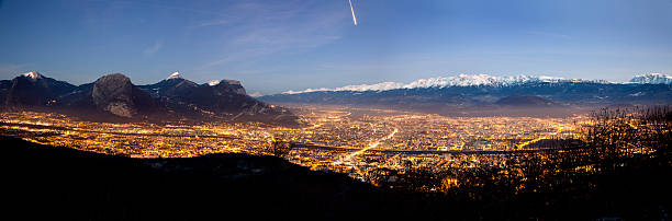 Panoramic view of Grenoble at night stock photo