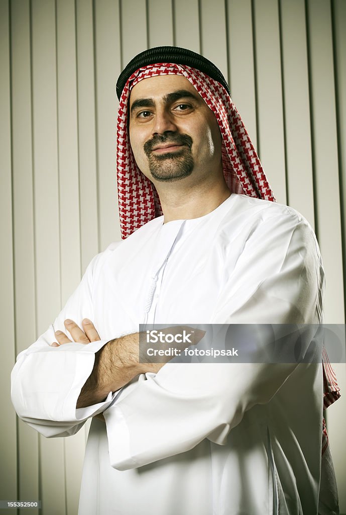 arabian businessman happy arabic businessman standing at the office Adult Stock Photo