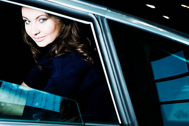 istock smiling woman in car 155353139