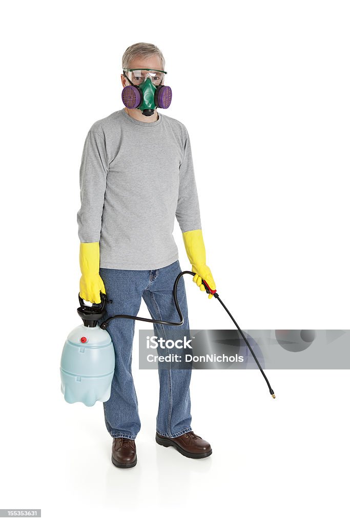 Uomo con spray per chimica - Foto stock royalty-free di Derattizzatore