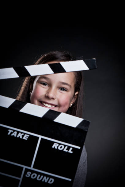 istock Happy child with movie clapper board. 155353632