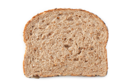 A slice of multiple grain bread on a 255 white background with a clipping path.
