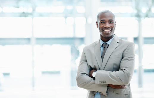 Handsome African American business representative looking at you confidently - Copyspace