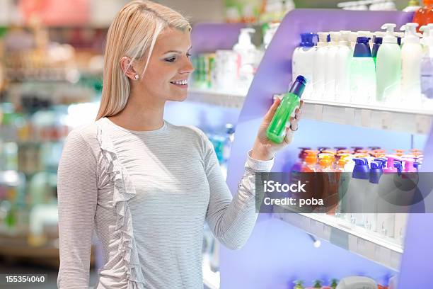 Buying Cosmetics For Body Care Stock Photo - Download Image Now - Supermarket, Shampoo, Make-Up