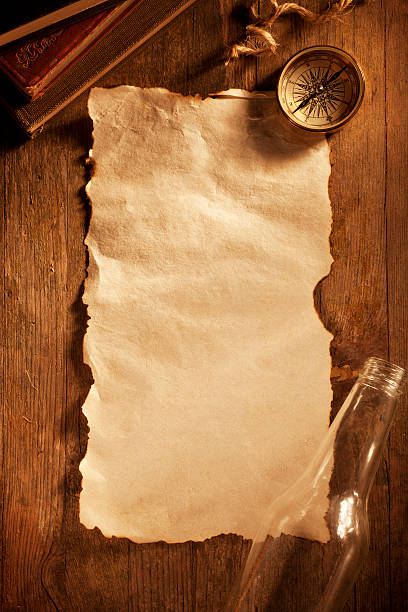 papier antique sur un bureau en bois - brigantine sailing ship old nautical vessel photos et images de collection