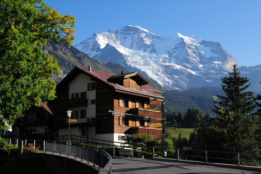 Beautiful Swiss landscape and house with the Jungfrau mountain background, the top of Europe 