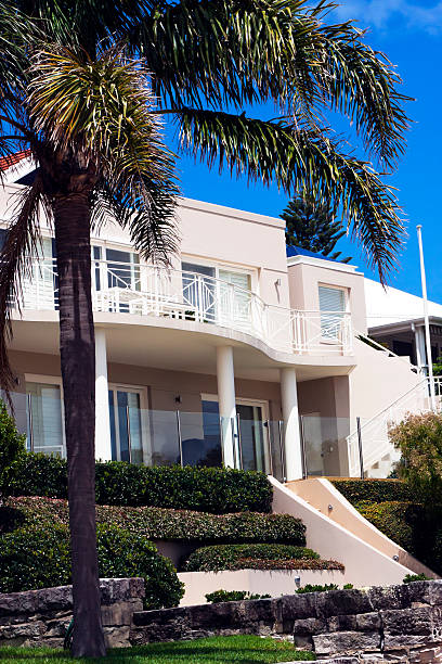 istock Luxury villa with columns and balcony against dark blue sky 155354787