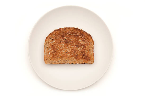 istock Slice of plain toast on white plate-isolated on white w/clipping path 155354869