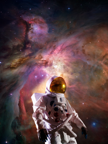 An astronaut in  a space suit with a round plate with trackers  for a title. Astronaut against the Earth
