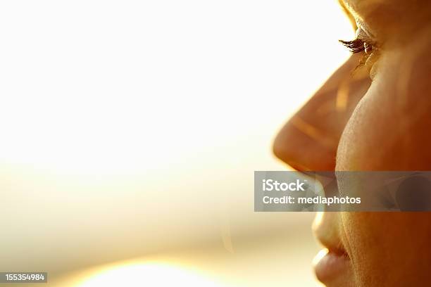 Looking At Sun Stock Photo - Download Image Now - Human Face, Women, Sunlight