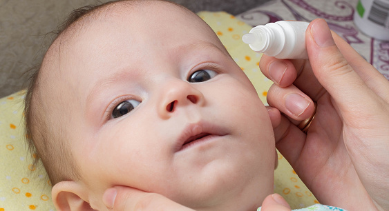 Instillation of medicinal drops in the eye of a child to treat conjunctivitis and blockage of the tear duct. Probing of the lacrimal canal, treatment.