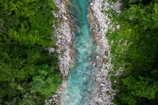 Aerial drone view of Soca river and green lush landscape in Slovenia at summer stock photo