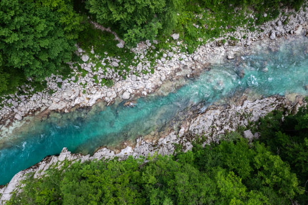 istock Soca river, Slovenia. Crystal clear and emerald green landscape. Drone View 1553552283