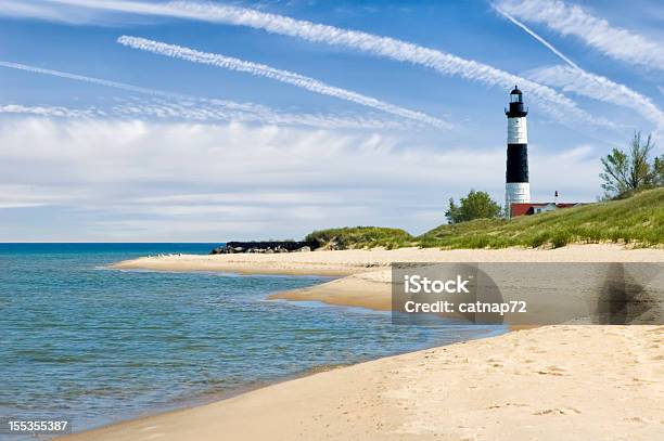 Lighthouse And Beach In Summer With Dramatic Sky Background Stock Photo - Download Image Now