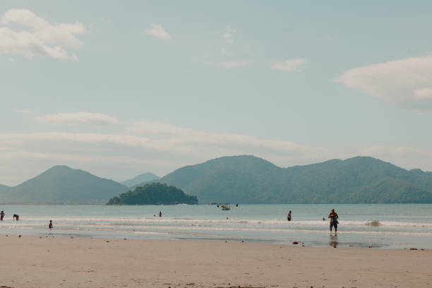 istock tourists at the beach 1553554273
