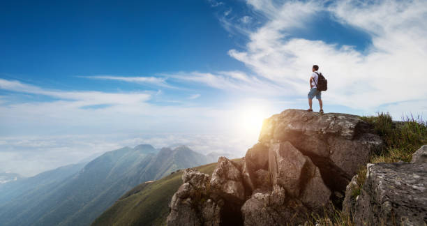 istock Backpacker on top of the mountain 1553554285