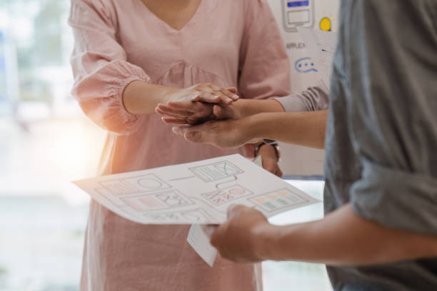 istock Close up of Business team stacking hands and collaboration and analyze financial data for long term investments and workflow diagram 1553554511