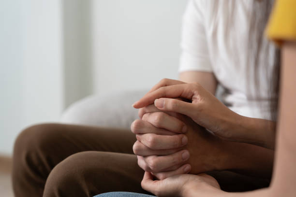 istock Couple hold hand support each while discussing family issues with psychiatrist. Husband encourages and empathy wife suffers depression. psychological, save divorce, Hand in hand together, trust, care 1553557029