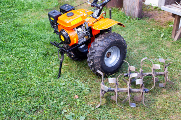 istock cutters complete with walk-behind tractor for work on the ground. Technique for agriculture. Motor cultivator. Copy space for text 1553558162