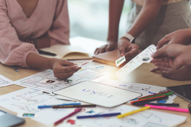 Close up of developer and ui designer brainstorming interface wireframe design.Creative digital development agency Close up of developer and ui designer brainstorming interface wireframe design.Creative digital development agency. chief of staff stock pictures, royalty-free photos & images