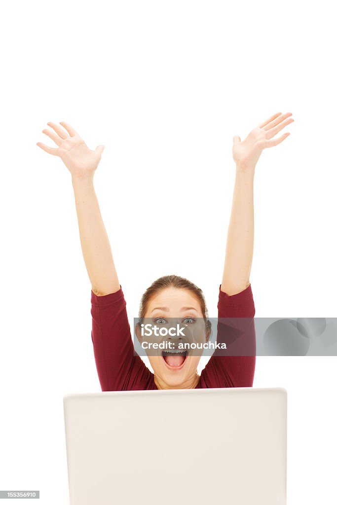 Excited Young Woman using laptop 20-24 Years Stock Photo