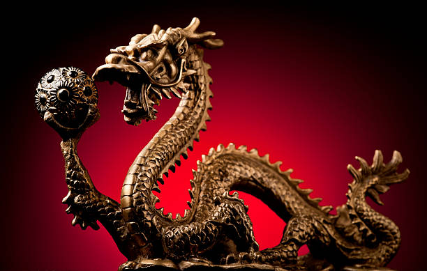 istock Chinese Dragon and Golden Orb 155357188