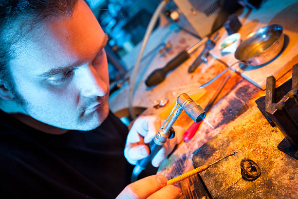 istock Jeweller repairing old ring 155357209