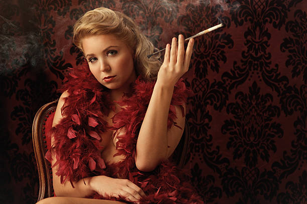 istock glamorous woman smoking - vintage style 155357246