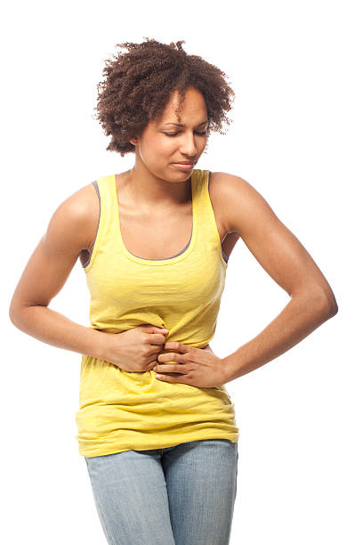 Woman suffering from a stomach ache Woman suffering from a stomach achehttp://www.vela-photo.com/istock/actors.jpg stomach cramps stock pictures, royalty-free photos & images