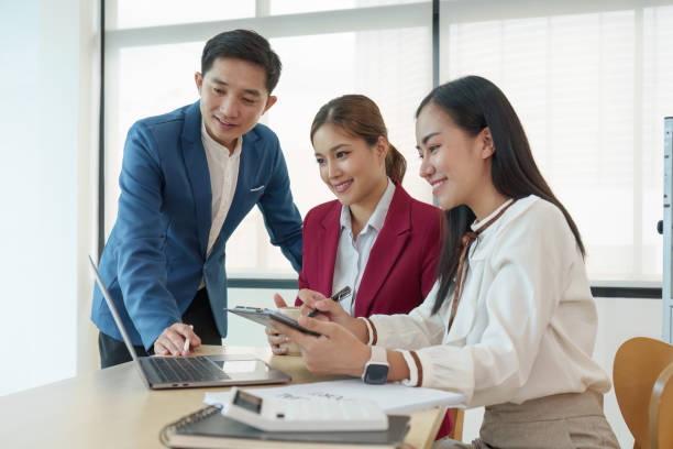 istock Diverse business team stacking hands and collaboration and analyze financial data for long term investments 1553576115