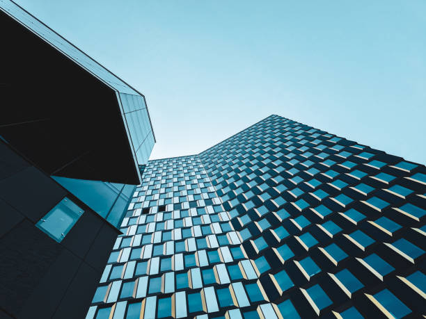 istock Low angle view of modern buildings against sky 1553577209