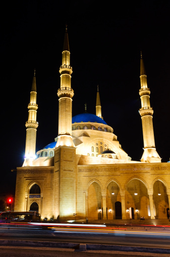 Cars drive at night past the Mohammad Al-Amin Mosque in Beirut, Lebanon.