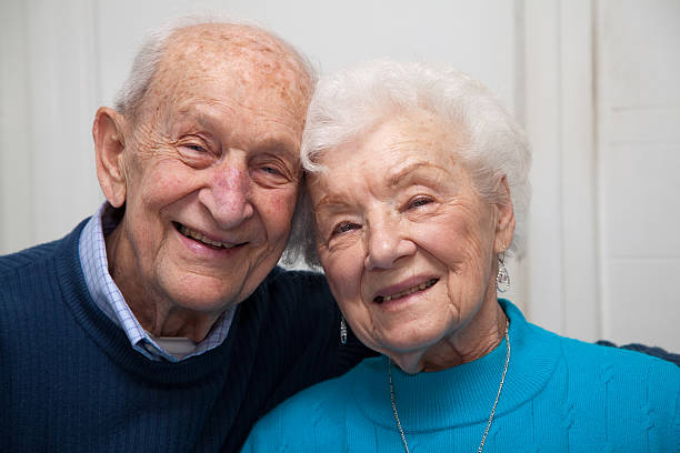 istock Couple celebrates 69th anniversary, leaning heads together 155357759