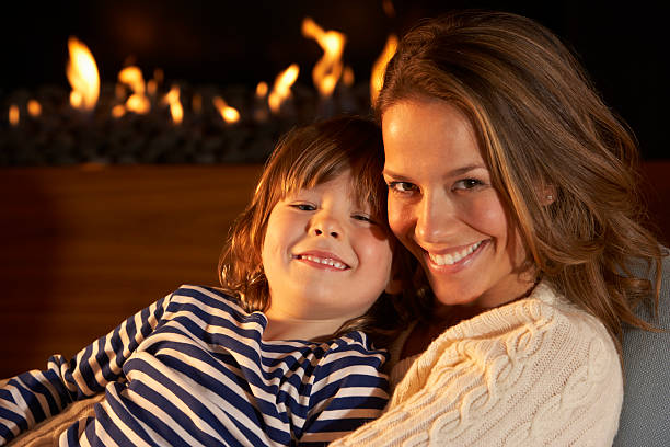 istock Portrait mother and son by firelight 155358135