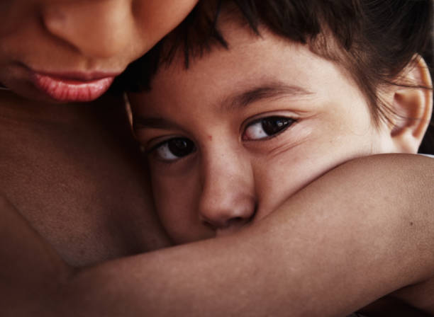 istock Mother and daughter cuddling 155358167