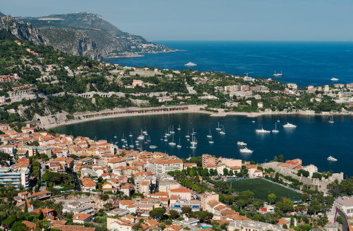 High level wide angle panorama of the Cote d'Azur, showing the beach and Bay of Villefranche and Cap Ferrat.