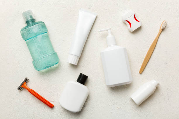 istock Mockup for bathing products top view flat lay, spa razor, toothpaste, soap, gel and other various accessories. Cosmetics for skin health. Bath Mockup for your logo 1553582786