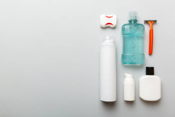 Composition with bath cosmetics on table. razor, toothpaste, soap, gel, toothbrush, mouthwash and other various accessories. Cosmetics for skin health. Bath Mockup for your logo