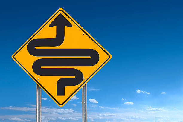 Conceptual road sign indicating extremely curvy conditions ahead - tight clipping path for sign included. Photographed with a Canon 5D MarkII DSLR - sign cleaned up and graphic added in Photoshop.